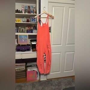 FREE PEOPLE MOVEMENT Hot Shot Onesie XS in bright watermelon orange some flaws
